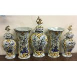 An unusual five piece Delft garniture of vases dec