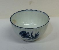 A small tapering Worcester tea bowl with fluted de