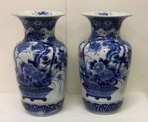 A tall pair of Japanese blue and white vases with