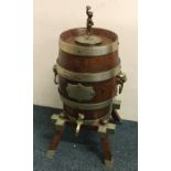 A good oak spirit barrel on stand with plated moun