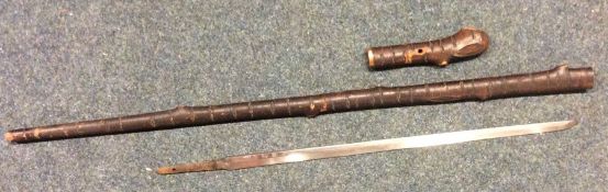 An unusual Japanese sword stick of bark form with