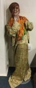 A novelty child's mannequin with Oriental clothes.