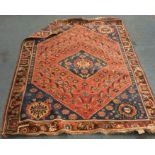 An old Oriental patterned rug. Est. £30 - £50.