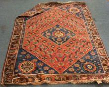 An old Oriental patterned rug. Est. £30 - £50.