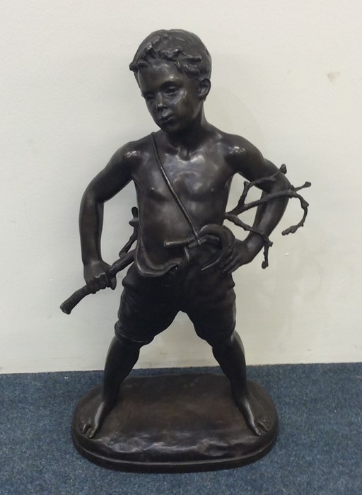 A large spelter figure of a child in standing posi