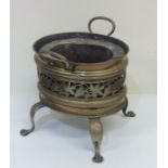 An Antique brass jardiniere with leaf decoration.