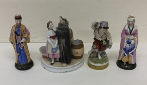 A group of porcelain figures decorated in bright c