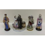 A group of porcelain figures decorated in bright c