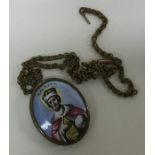 A small Italian religious miniature on gilt chain.