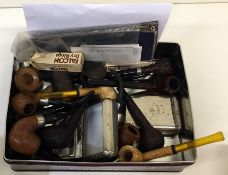A box containing old wooden, Bakelite and resin pi