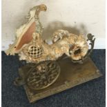 An unusual large brass cornucopia shell mounted wi