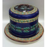 A large majolica cheese dome decorated with acorns
