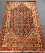 An old Oriental patterned rug. Est. £30 - £50.