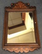 An attractive bevel edged oak mirror with inlaid d