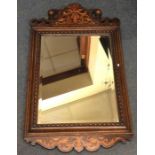 An attractive bevel edged oak mirror with inlaid d