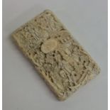 A good quality carved ivory card case with lift-o