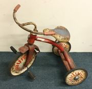 A vintage child's Raleigh tricycle with painted bo