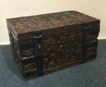 A heavy Continental metal bound trunk carved with