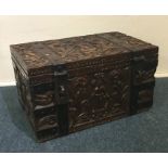 A heavy Continental metal bound trunk carved with