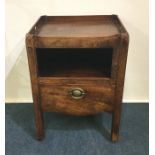 A Georgian mahogany commode on square reeded suppo