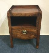 A Georgian mahogany commode on square reeded suppo