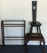 A carved oak hall chair together with a stool and