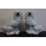 A pair of Staffordshire dogs of typical design. Es