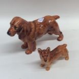 A Royal Doulton figure of a cocker spaniel togethe