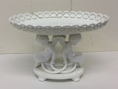 An attractive porcelain centrepiece decorated with
