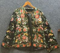 An Oriental style jacket with extensive floral emb