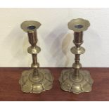 A pair of 18th Century brass candlesticks with sha
