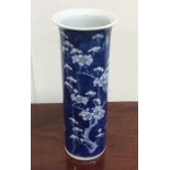 A tall Chinese blue and white vase decorated with