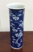 A tall Chinese blue and white vase decorated with