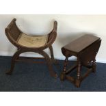 An oak drop leaf table together with a piano stool