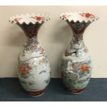 A pair of massive Japanese baluster shaped vases d