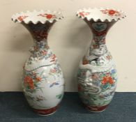 A pair of massive Japanese baluster shaped vases d