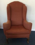 A stylish armchair with scroll decoration. Est. £3