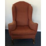 A stylish armchair with scroll decoration. Est. £3