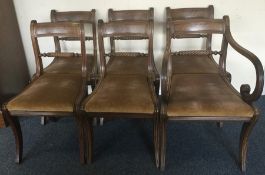 A set of six (plus one) mahogany sabre leg chairs