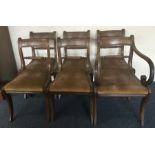 A set of six (plus one) mahogany sabre leg chairs