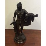 A stylish bronzed figure of a semi-naked man on ci