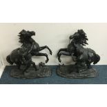 A large pair of spelter figures depicting rearing