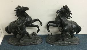 A large pair of spelter figures depicting rearing