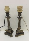 A pair of good brass Empire lamps on shaped bases