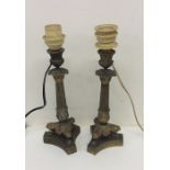 A pair of good brass Empire lamps on shaped bases