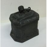 A good Antique lead tea caddy with lion finial. Es