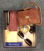 A box containing old camera, buttons etc. Est. £20
