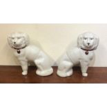 A pair of Staffordshire dogs with frosted decorati