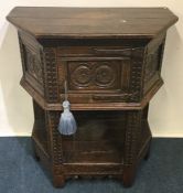 A small 17th Century style hall cupboard attractiv