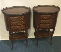 A pair of good quality oval parquetry inlaid bedsi